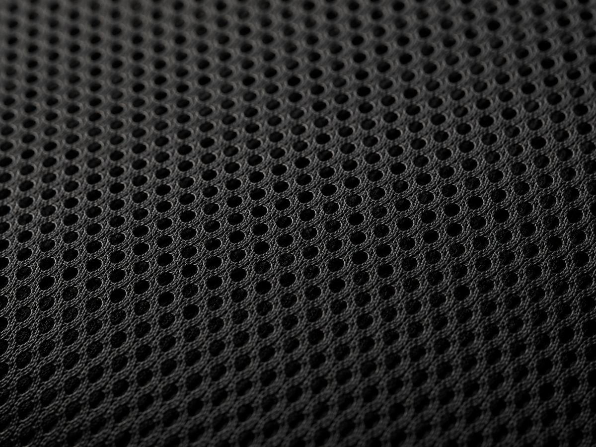 Close-up of the Ostinea Cushion’s black 3D spacer mesh, showing its raised breathable texture and open structure.